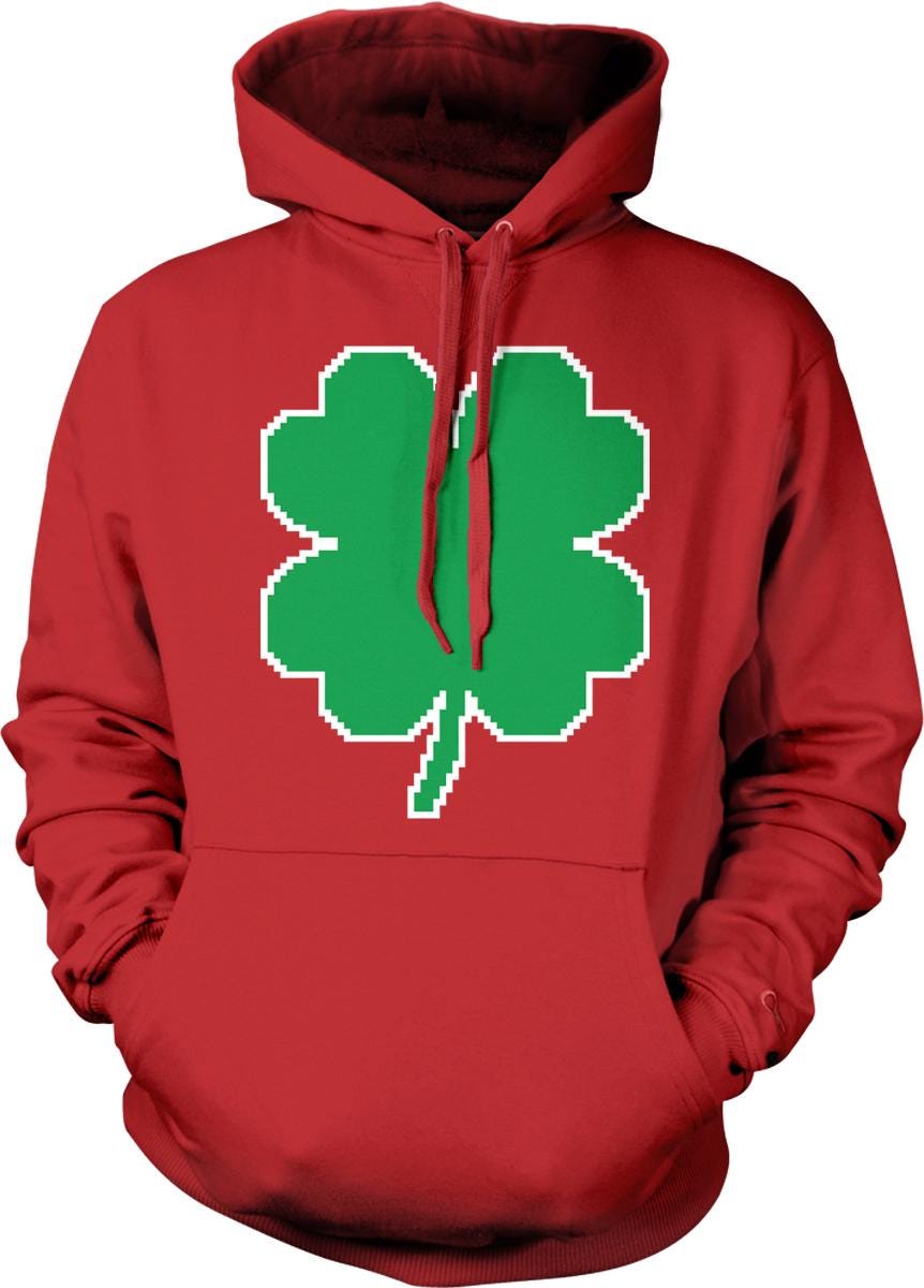 A red hoodie with a green four-leaf clover graphic printed on it.