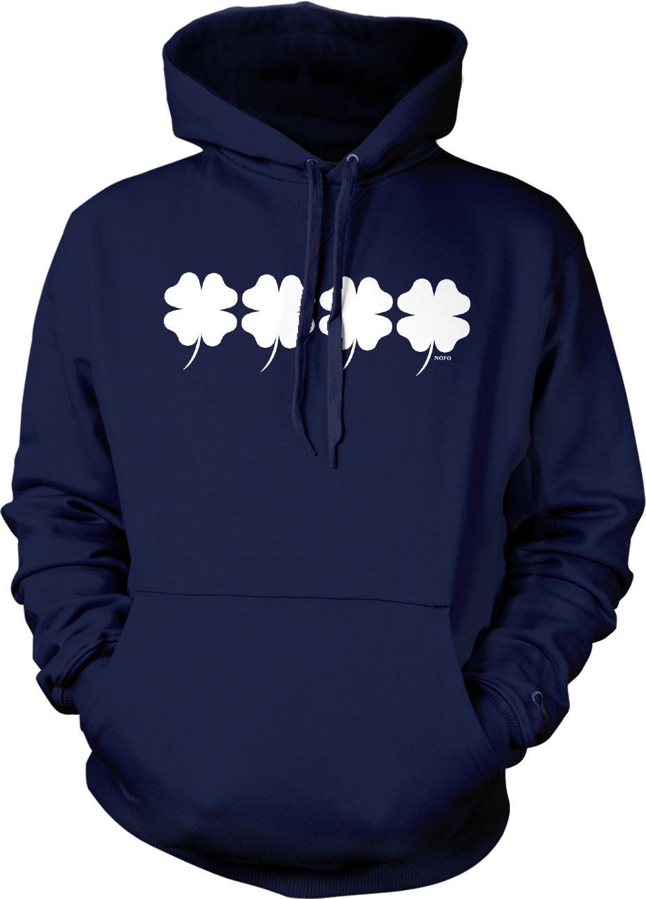 A navy blue hoodie with a white four-leaf clover design printed on it.
