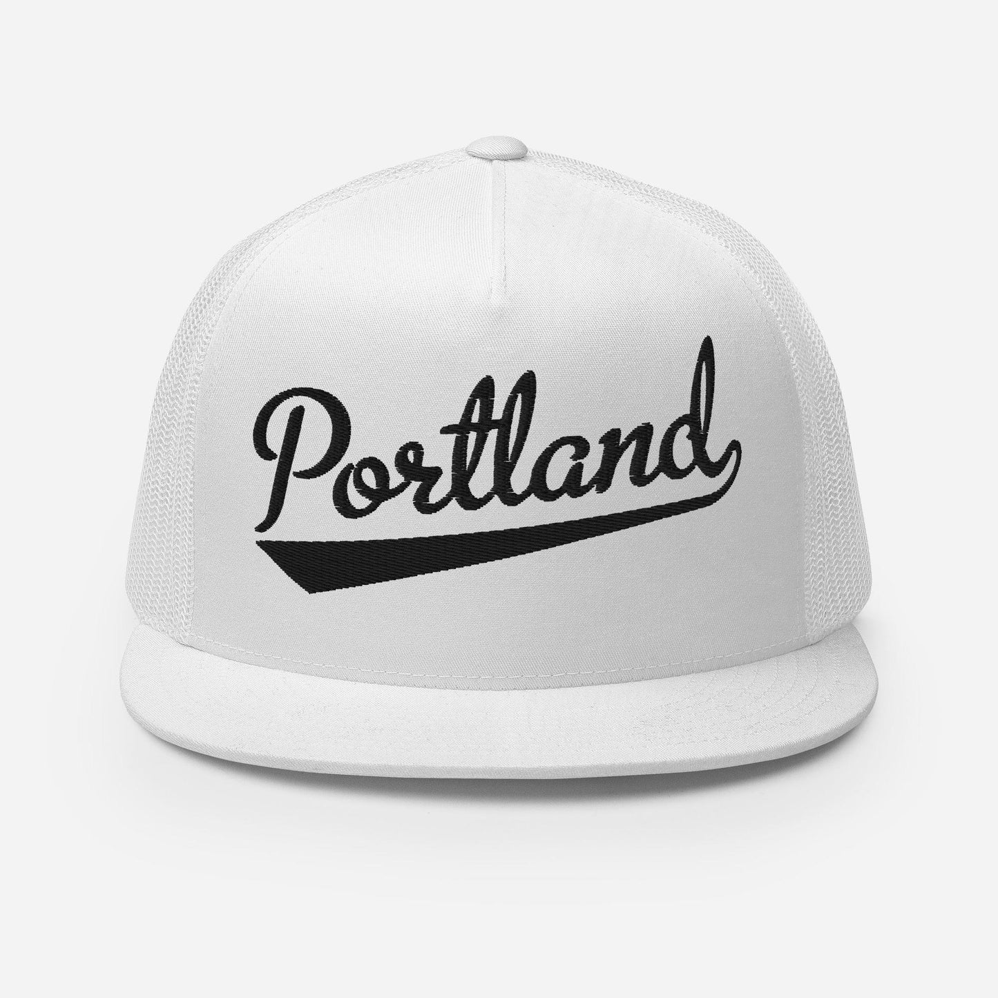 A white baseball cap with the word "Portland" printed on it in black text.