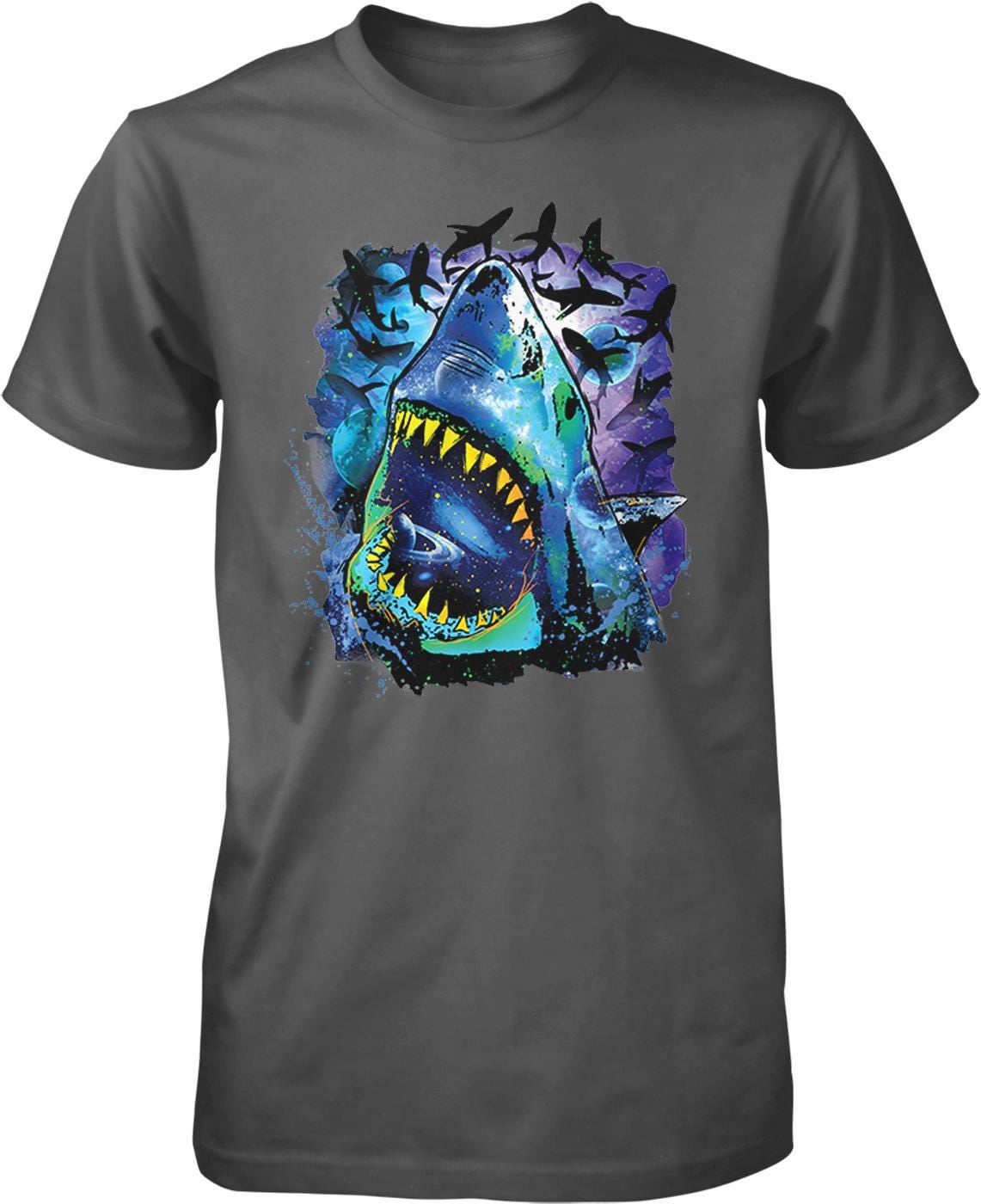 A t-shirt with a graphic design depicting a shark with its mouth open, surrounded by colorful and abstract elements.