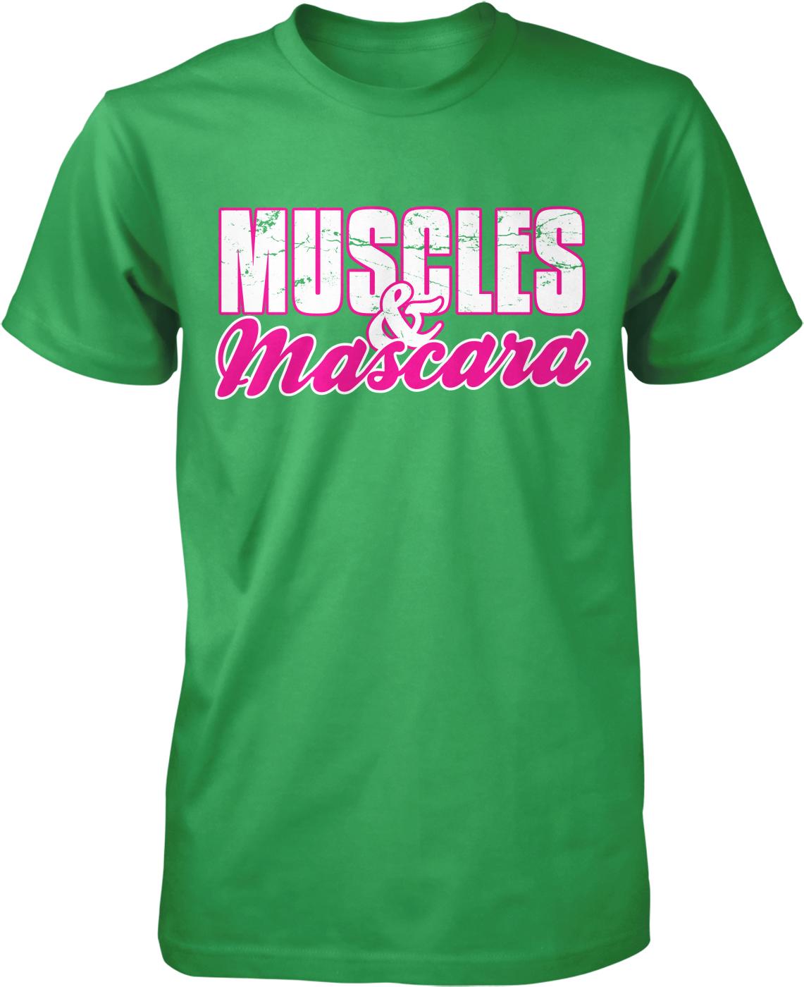 A green t-shirt with the text "MUSCLES & MASCARA" printed on it in pink and white lettering.