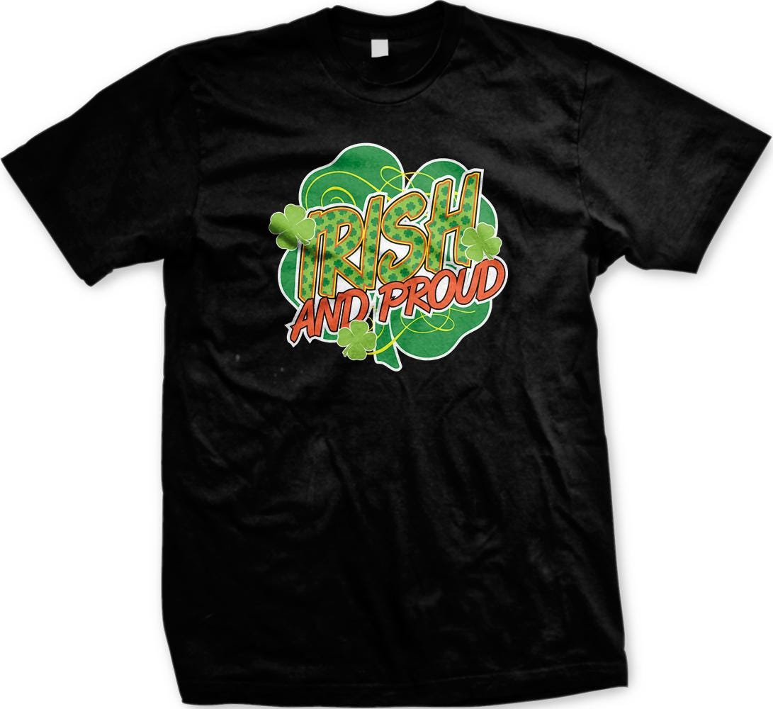A black t-shirt with a graphic design featuring the text "IRISH AND PROUD" surrounded by a shamrock and clovers.