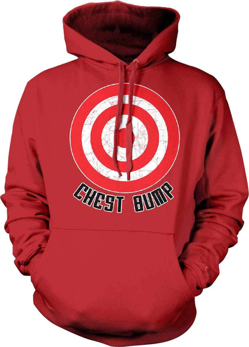A red hoodie with a graphic design on the front, depicting a target with a bullseye and the text "CHEST BUMP" below it.