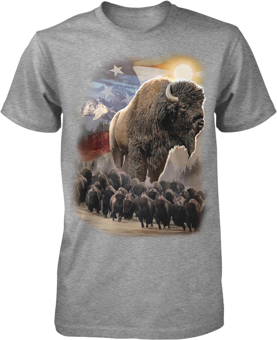 A t-shirt design featuring a large buffalo surrounded by smaller buffalo, with a backdrop of mountains, a flag, and a bright sun.