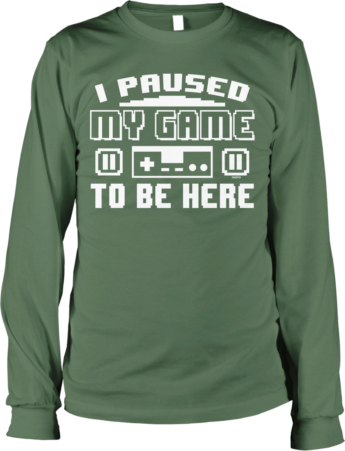 A green long-sleeved t-shirt with the text "I PAUSED MY GAME TO BE HERE" printed on it.