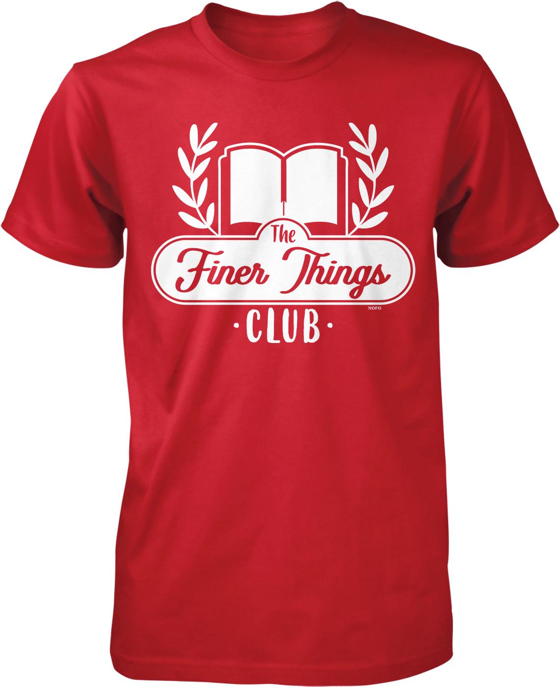 A red t-shirt with a white graphic design featuring a book and laurel wreath, along with the text "The Finer Things Club" printed on it.