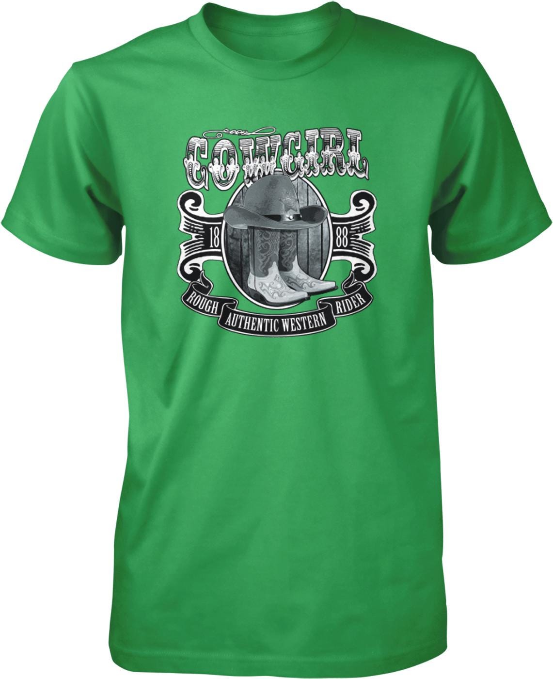 A green t-shirt with a graphic design featuring a cowboy hat, boots, and the text "COWGIRL" prominently displayed.