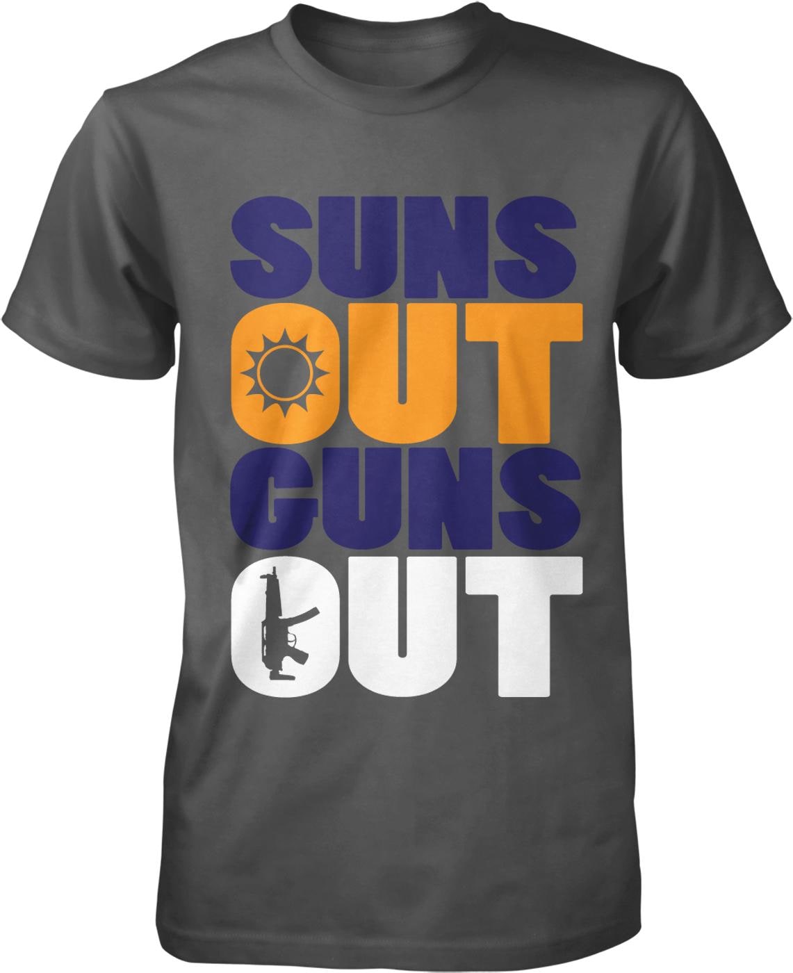 A gray t-shirt with the text "SUNS OUT GUNS OUT" printed on it.