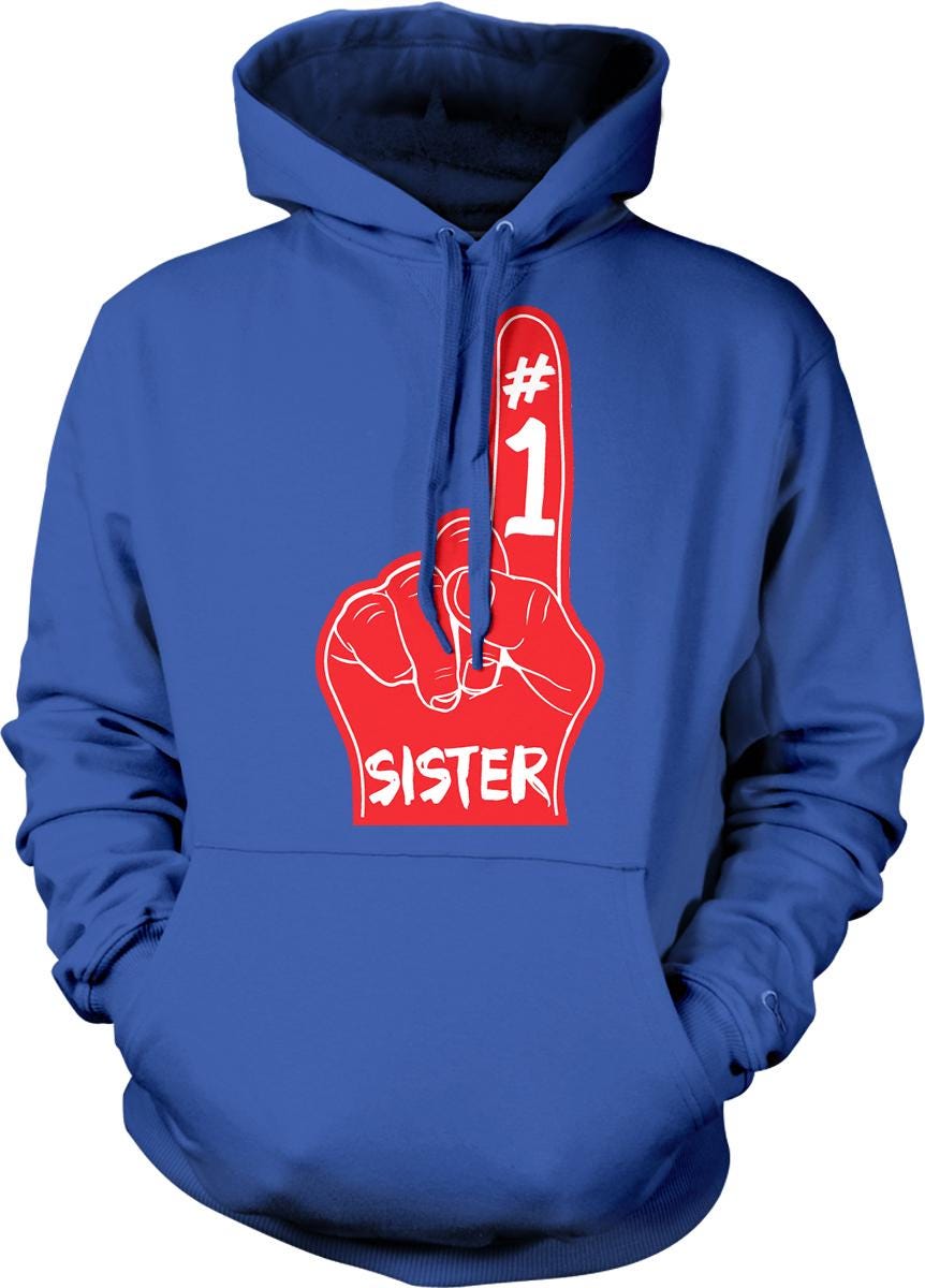A blue hoodie with a red graphic design on the front, depicting a hand with the number 1 and the word "SISTER" written below it.