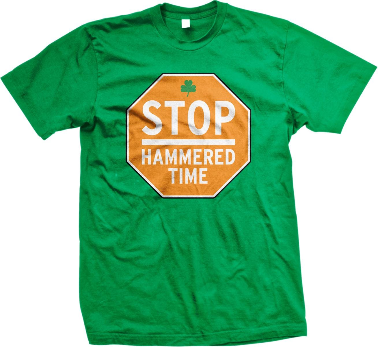 A green t-shirt with a printed text and a shamrock symbol on it.