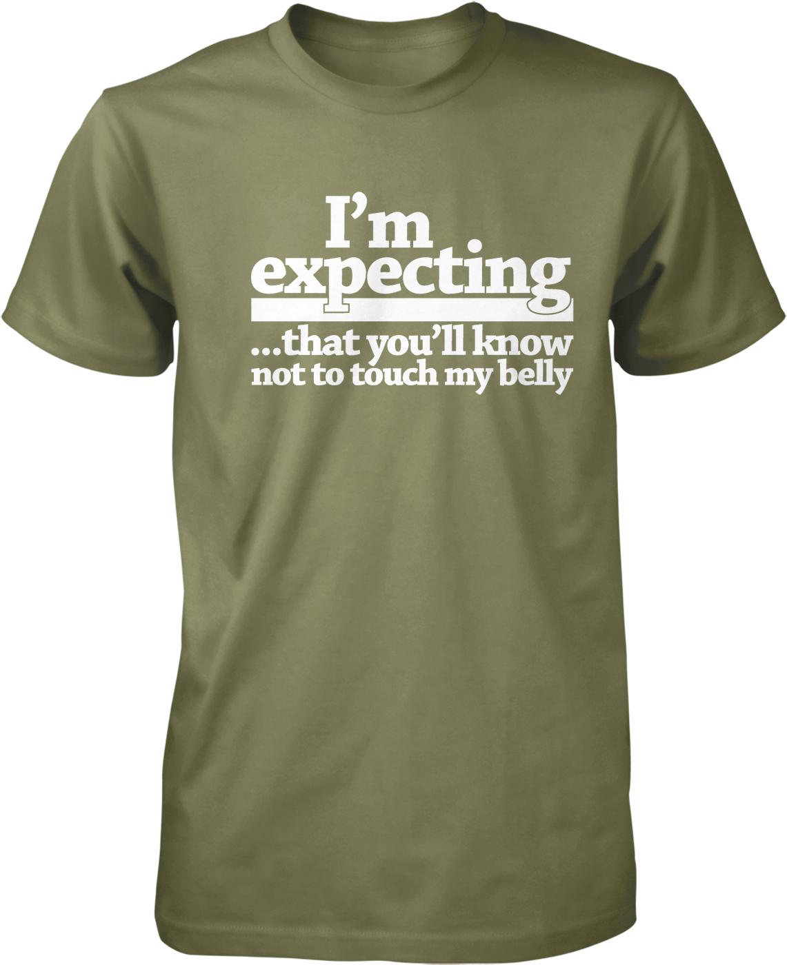 A green t-shirt with white text that reads "I'm expecting... that you'll know not to touch my belly".