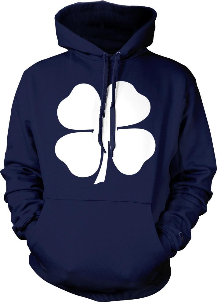 A navy blue hoodie with a white four-leaf clover design on the front.