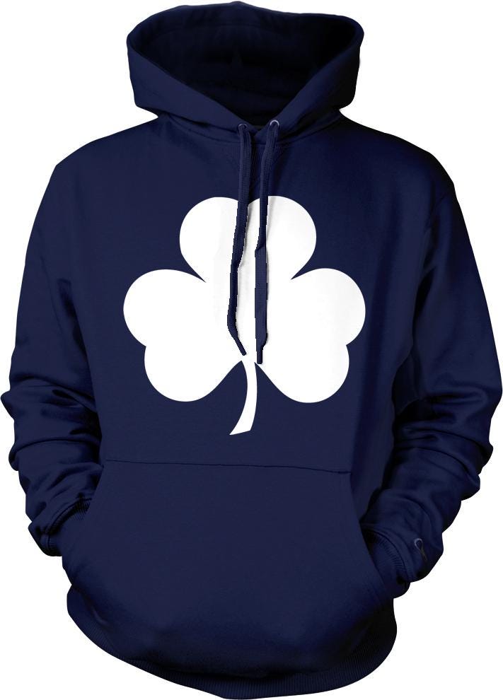 A navy blue hoodie with a white clover graphic printed on it.