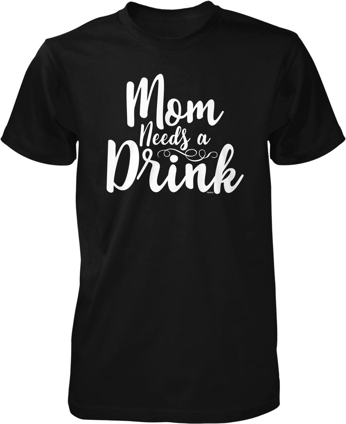 A black t-shirt with white text that reads "Mom Needs a Drink".