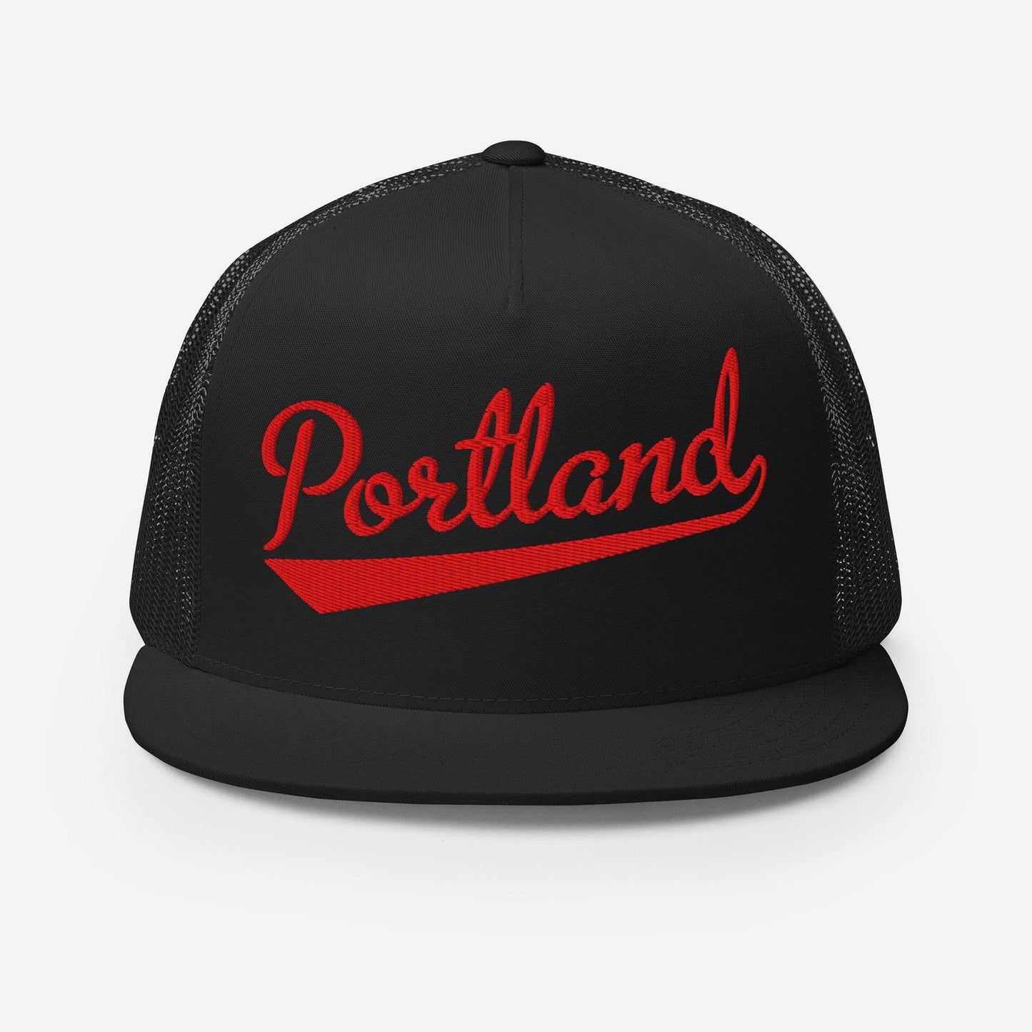 A black baseball cap with the word "Portland" printed in red on it.