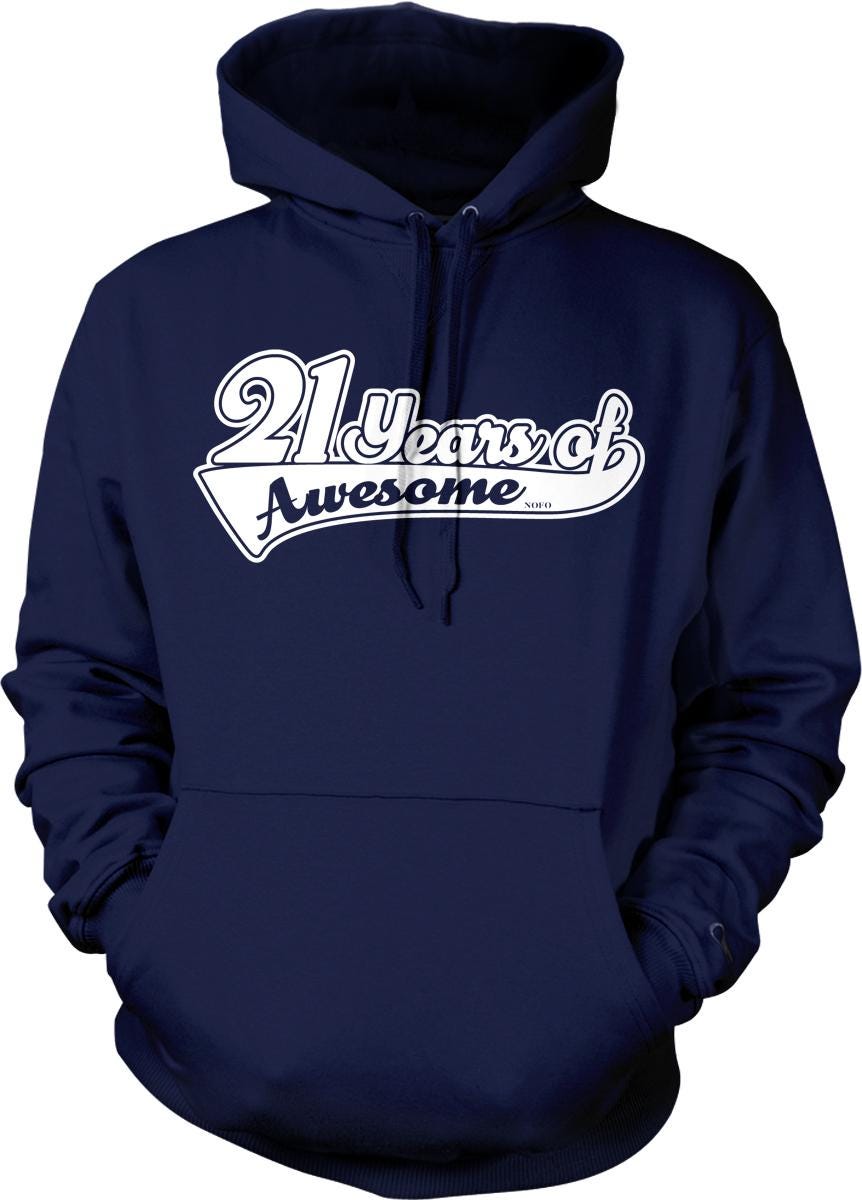 A navy blue hoodie with the text "21 Years of Awesome" printed on it.