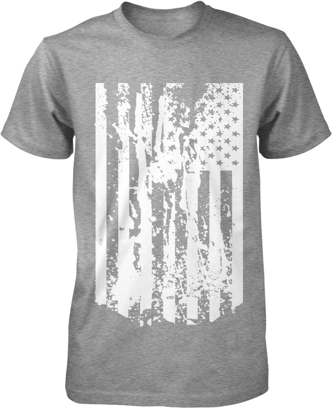 A gray t-shirt with a white graphic design depicting a distressed American flag.