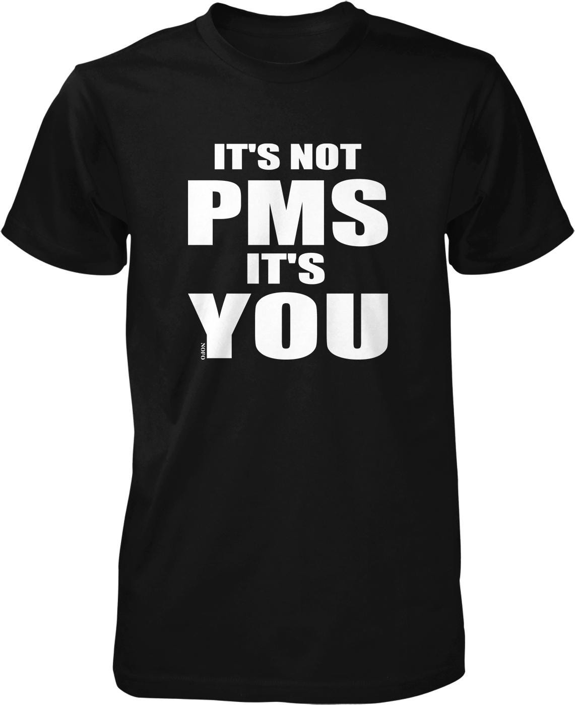 A black t-shirt with white text that reads "IT'S NOT PMS IT'S YOU".
