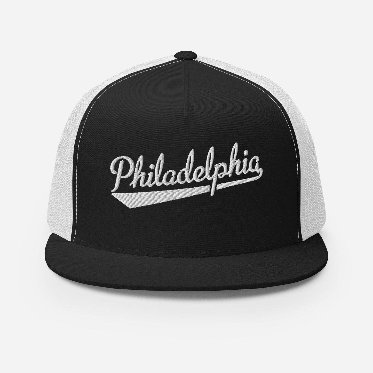 A black and white baseball cap with the word "PhiladELPHIA" embroidered on it.
