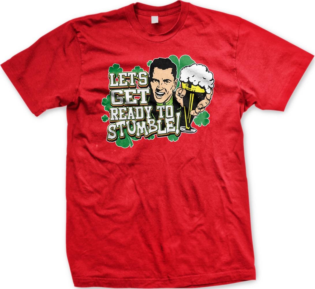 A red t-shirt with a graphic design featuring a smiling man holding a beer and the text "Let's Get Ready to Stumble!"