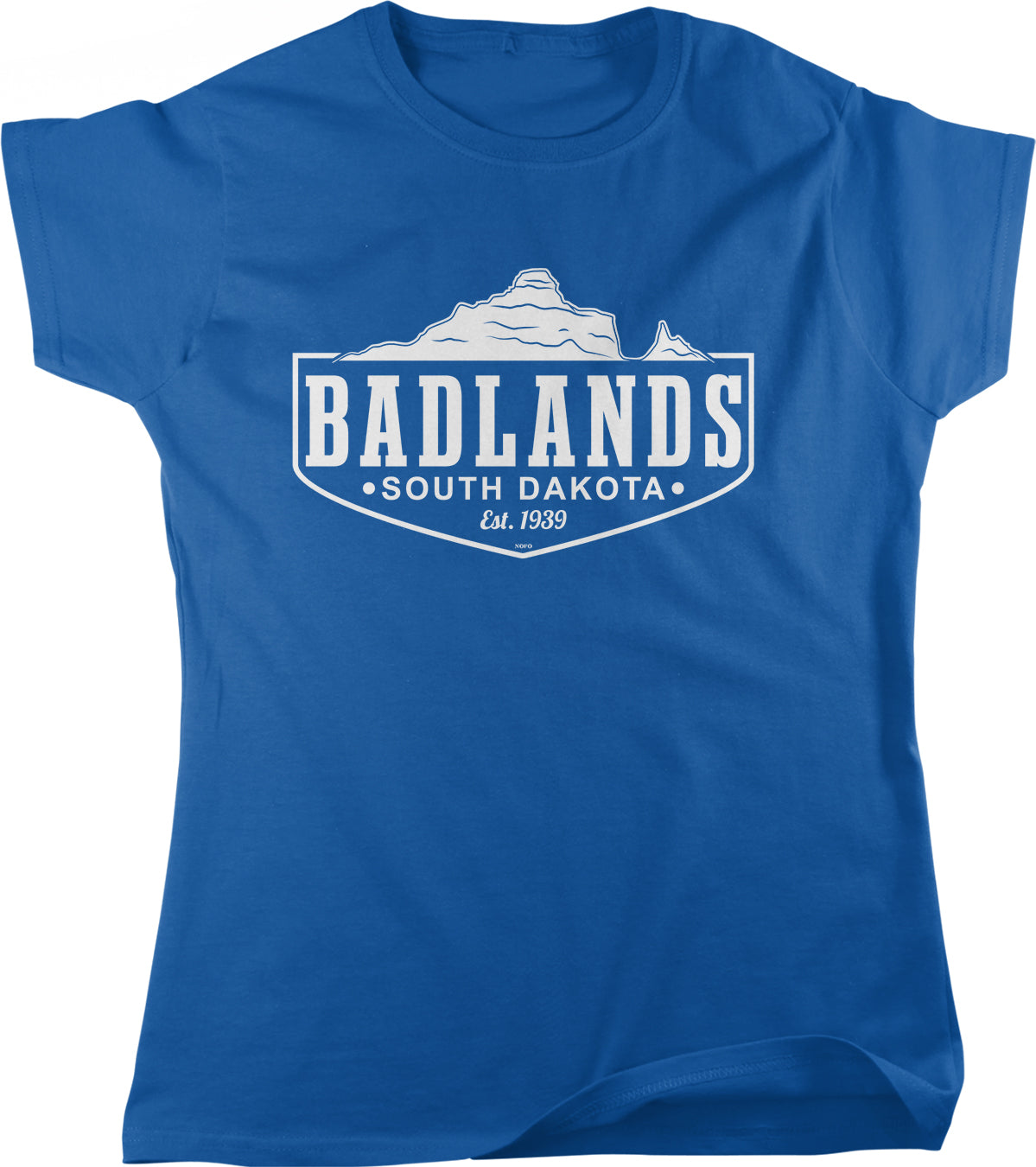 A blue t-shirt with a graphic design featuring a mountain and the text "BADLANDS SOUTH DAKOTA est. 1839".