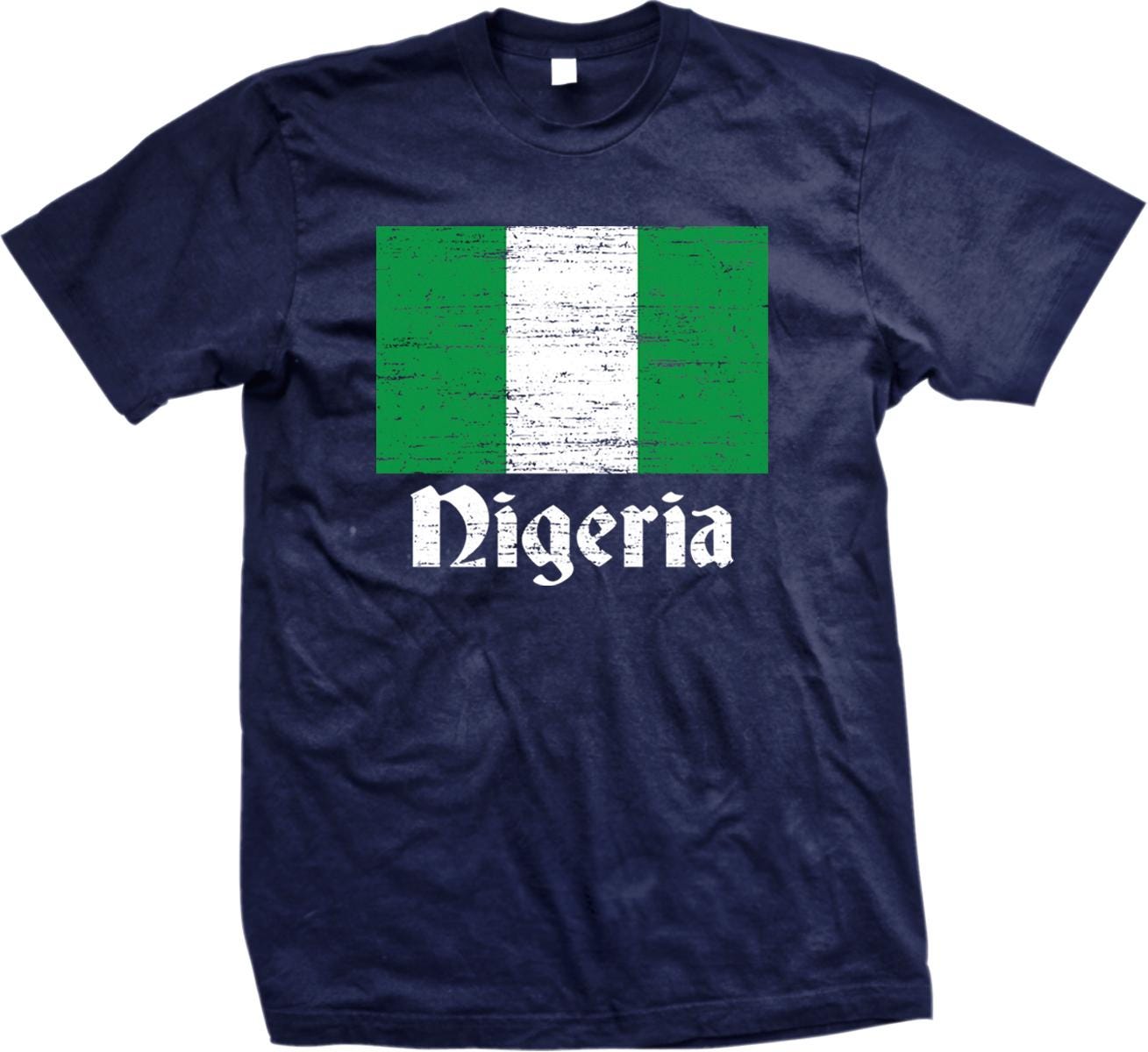 A navy blue t-shirt with a graphic design featuring the flag of Nigeria and the word &quot;Nigeria&quot; printed on it.