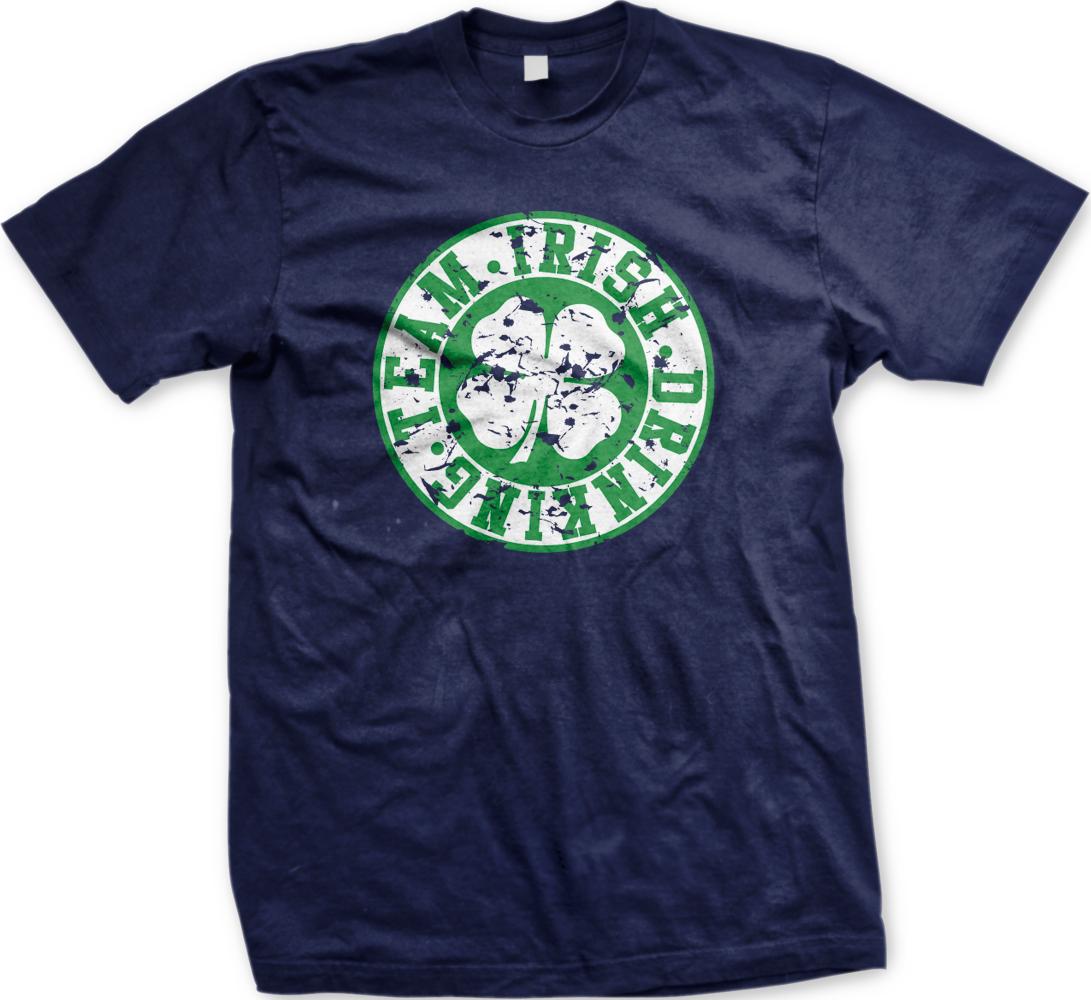 A navy blue t-shirt with a circular graphic design featuring a white and green clover flower and the text "TEAM. IRISH. DRINK. DARE. DARE. DRINK."