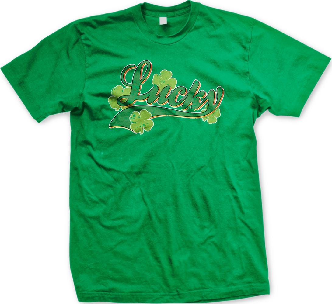 A green t-shirt with the word "Lucky" printed on it, along with four shamrocks.
