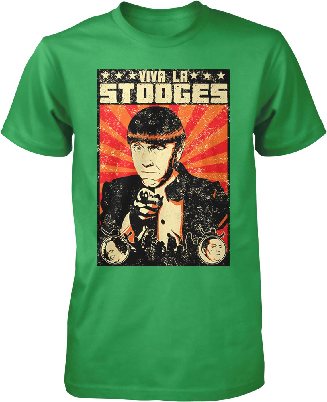 A green t-shirt with a graphic design featuring a portrait of a man with a serious expression, surrounded by various elements such as a clock, a bird, and a starburst background.