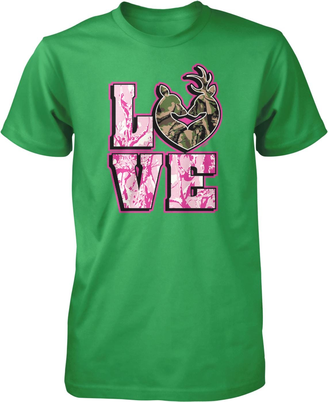 A green t-shirt with a graphic design featuring the word "LOVE" in pink and black letters, with a heart shape and a deer head in camouflage colors.