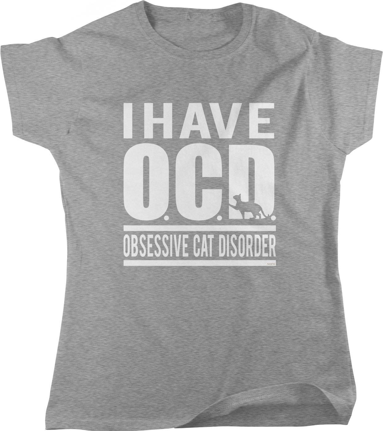 A gray t-shirt with the text "I HAVE OCCD OBSESSIVE CAT DISORDER" printed on it.