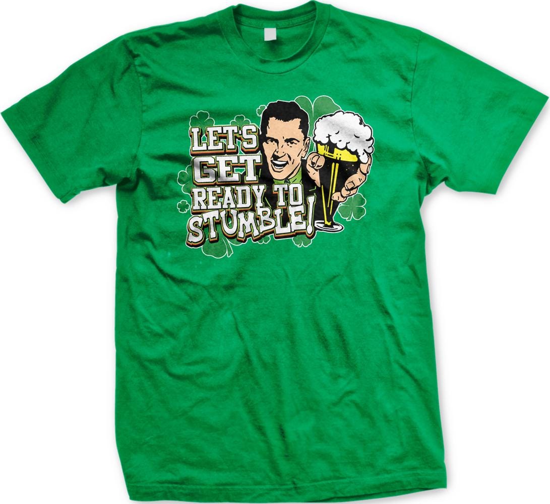A green t-shirt with a graphic design featuring a smiling man holding a beer and the text "Let's Get Ready to Stumble!"