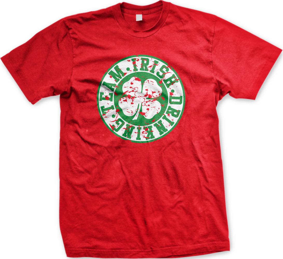 A red t-shirt with a circular graphic design featuring a white and green clover with the text "TEAM. IRISH. DRINK. DANCE." printed on it.
