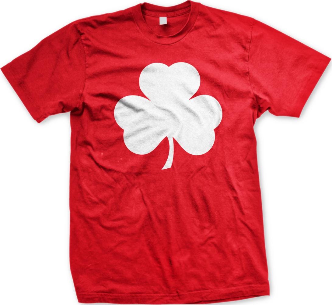 A red t-shirt with a white clover graphic printed on it.