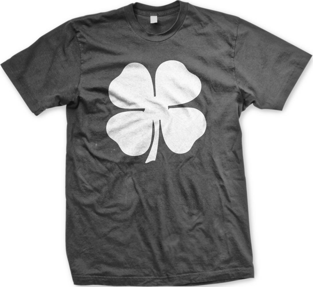 A black t-shirt with a white four-leaf clover graphic printed on it.