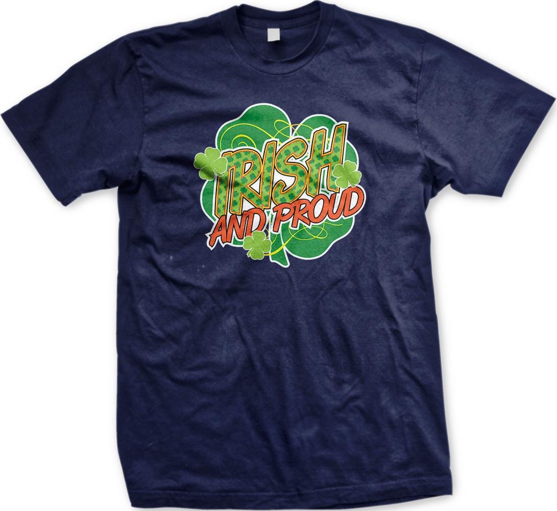 A navy blue t-shirt with a graphic design featuring the text "IRISH AND PROUD" surrounded by a shamrock and clovers.