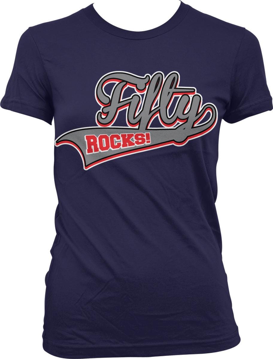 A navy blue t-shirt with a graphic design featuring the text "Fifty Rocks!" in a stylized font.