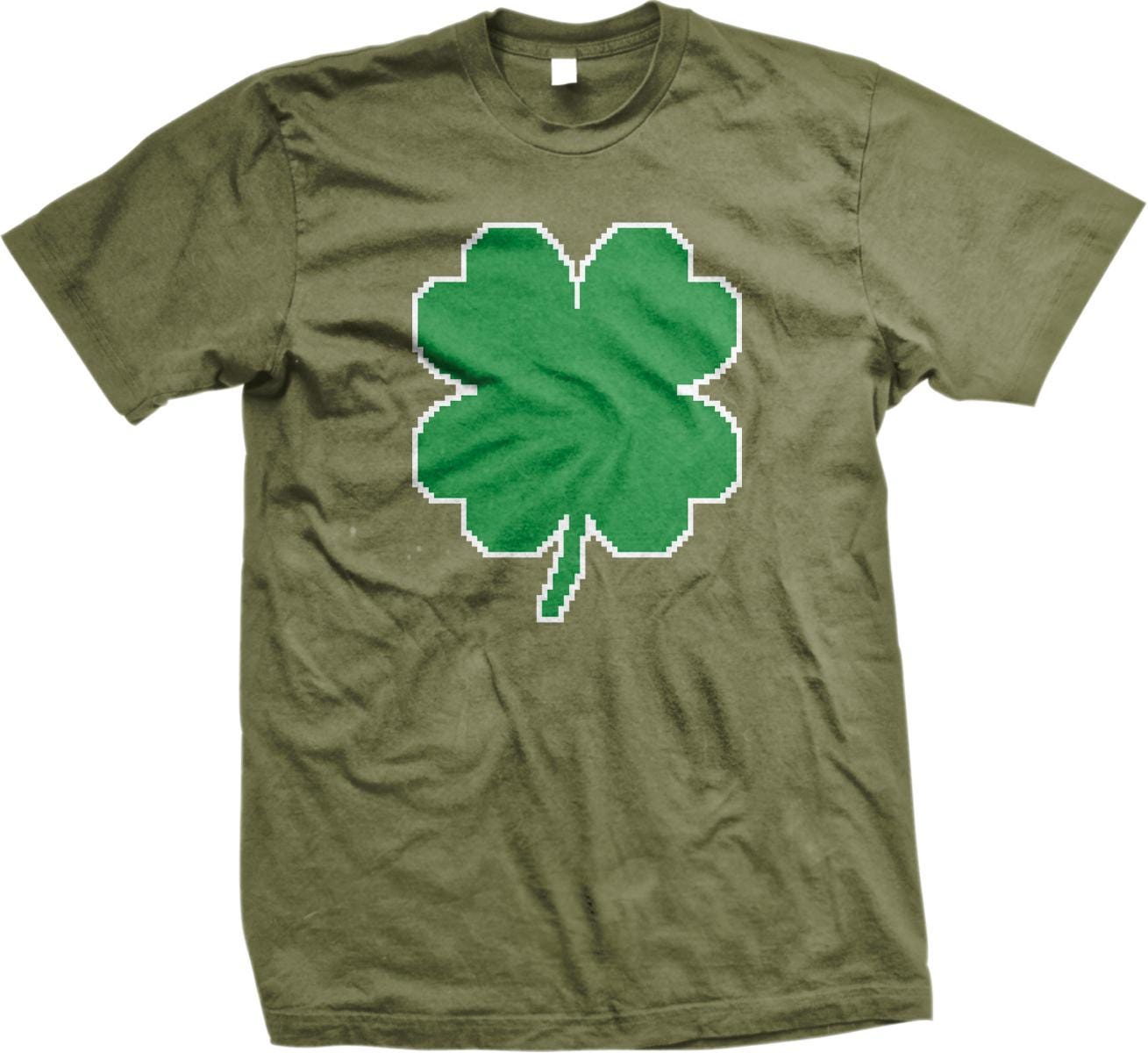 A green t-shirt with a large white four-leaf clover graphic printed on it.