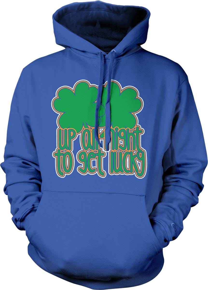 A blue hoodie with a graphic design featuring a green clover and the text "UP A LIGHT TO GET LUCKY" printed on it.