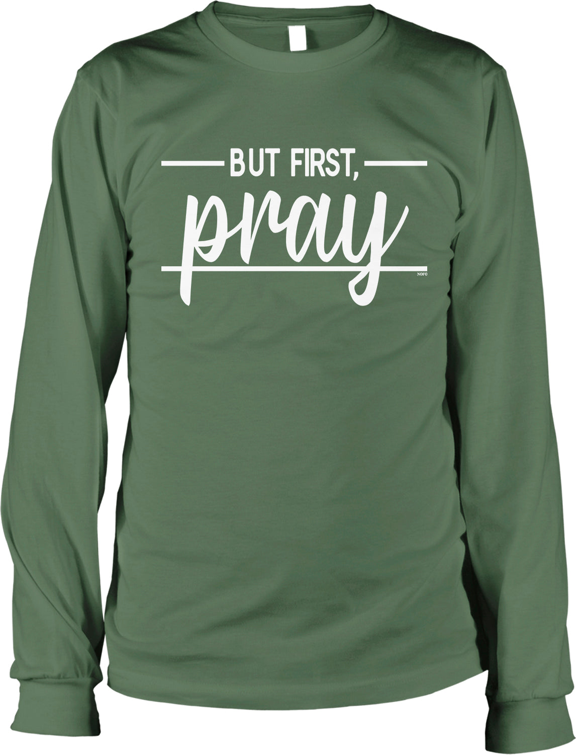 A green long-sleeved shirt with the text "BUT FIRST, PRAY" printed on it.