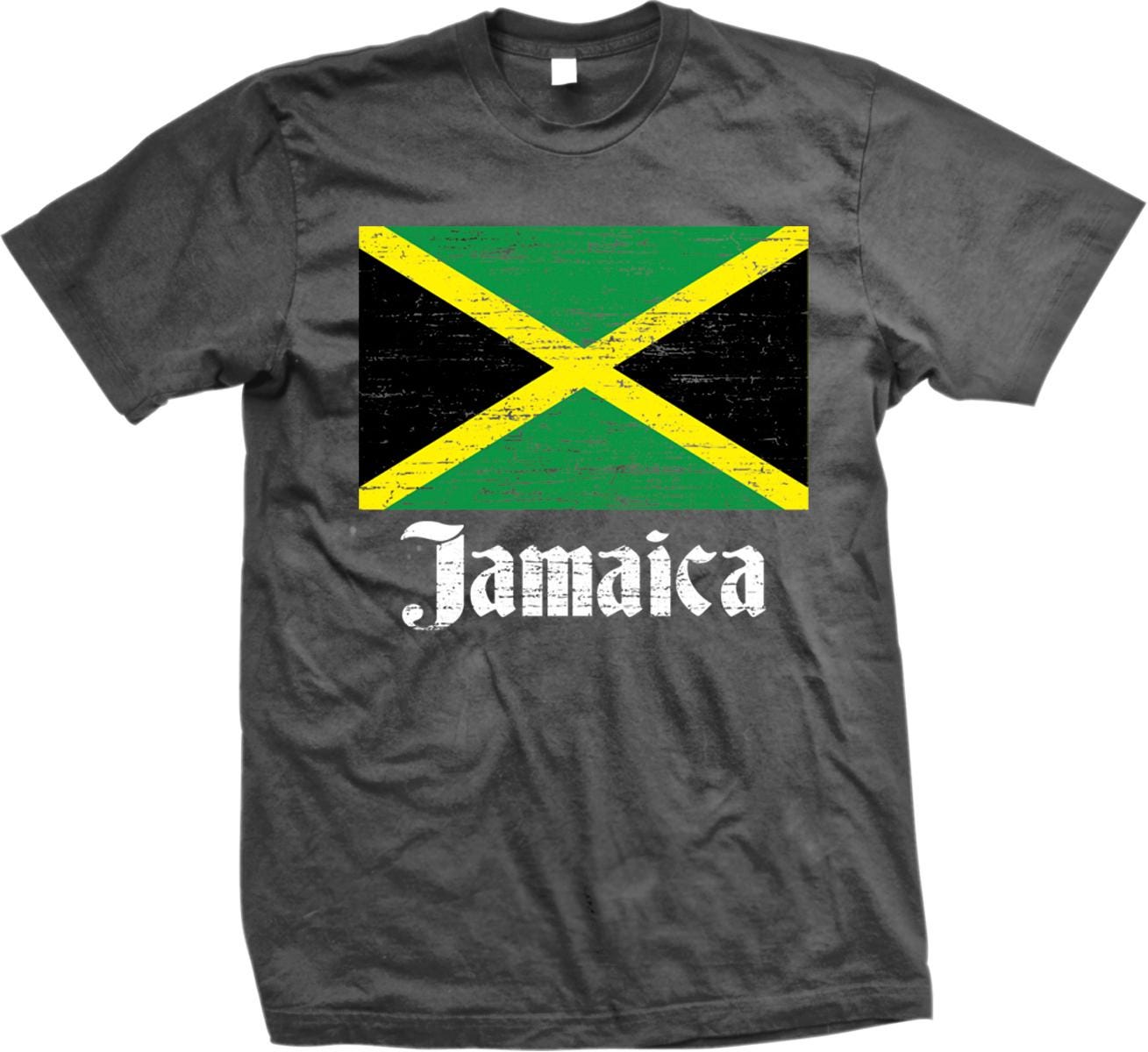 A gray t-shirt with a graphic of the Jamaican flag and the word "Jamaica" printed on it.