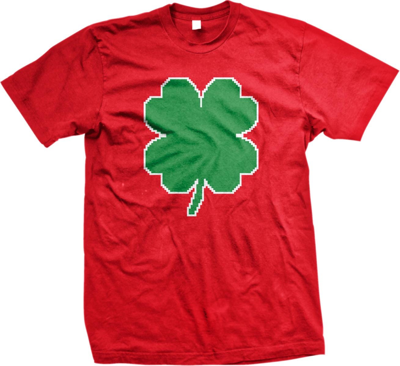 A red t-shirt with a green pixelated four-leaf clover design printed on it.