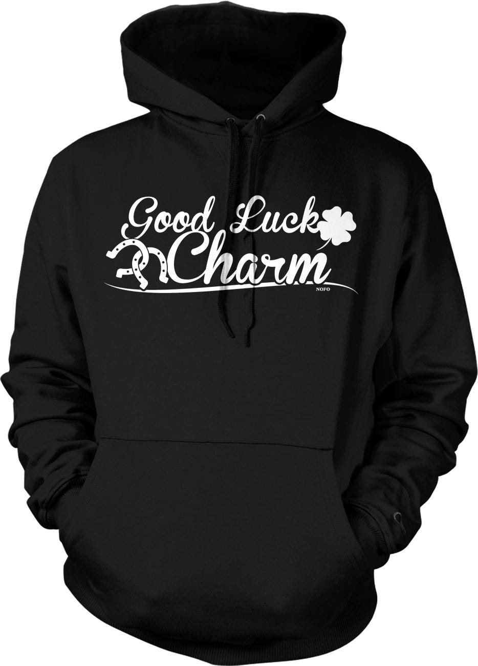 A black hoodie with white text that says "Good Luck Charm".