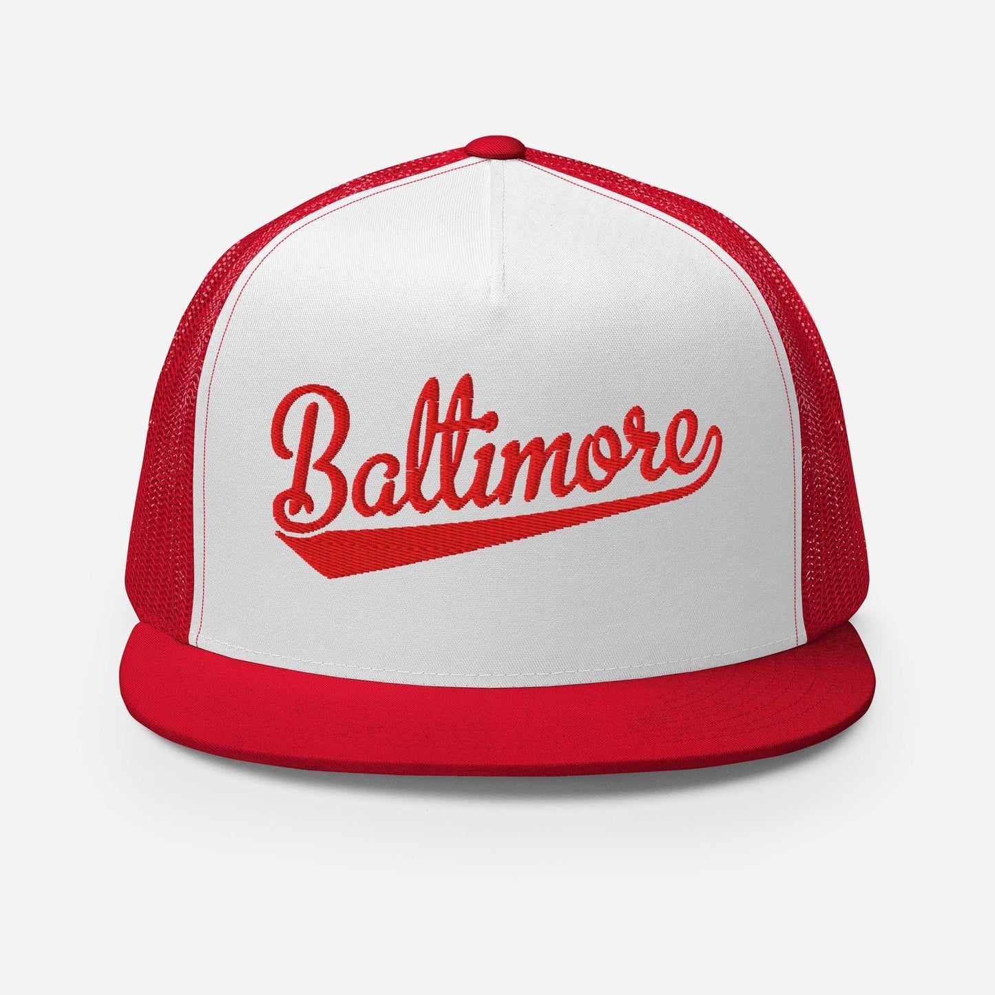 A red and white baseball cap with the word "Baltimore" printed on it.