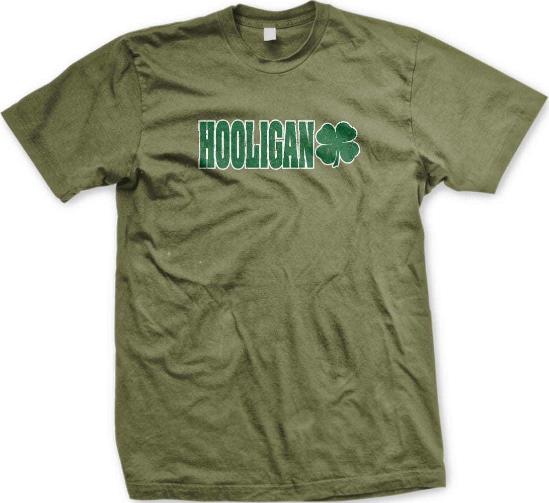 A green t-shirt with the word "HOOLIGAN" printed on it, along with a four-leaf clover symbol.