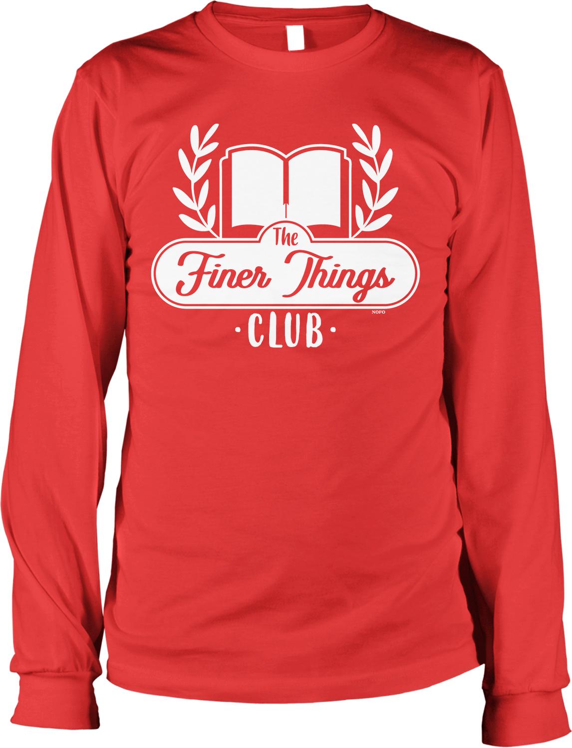 A red long-sleeved t-shirt with a white logo that says "The Finer Things Club" printed on it.