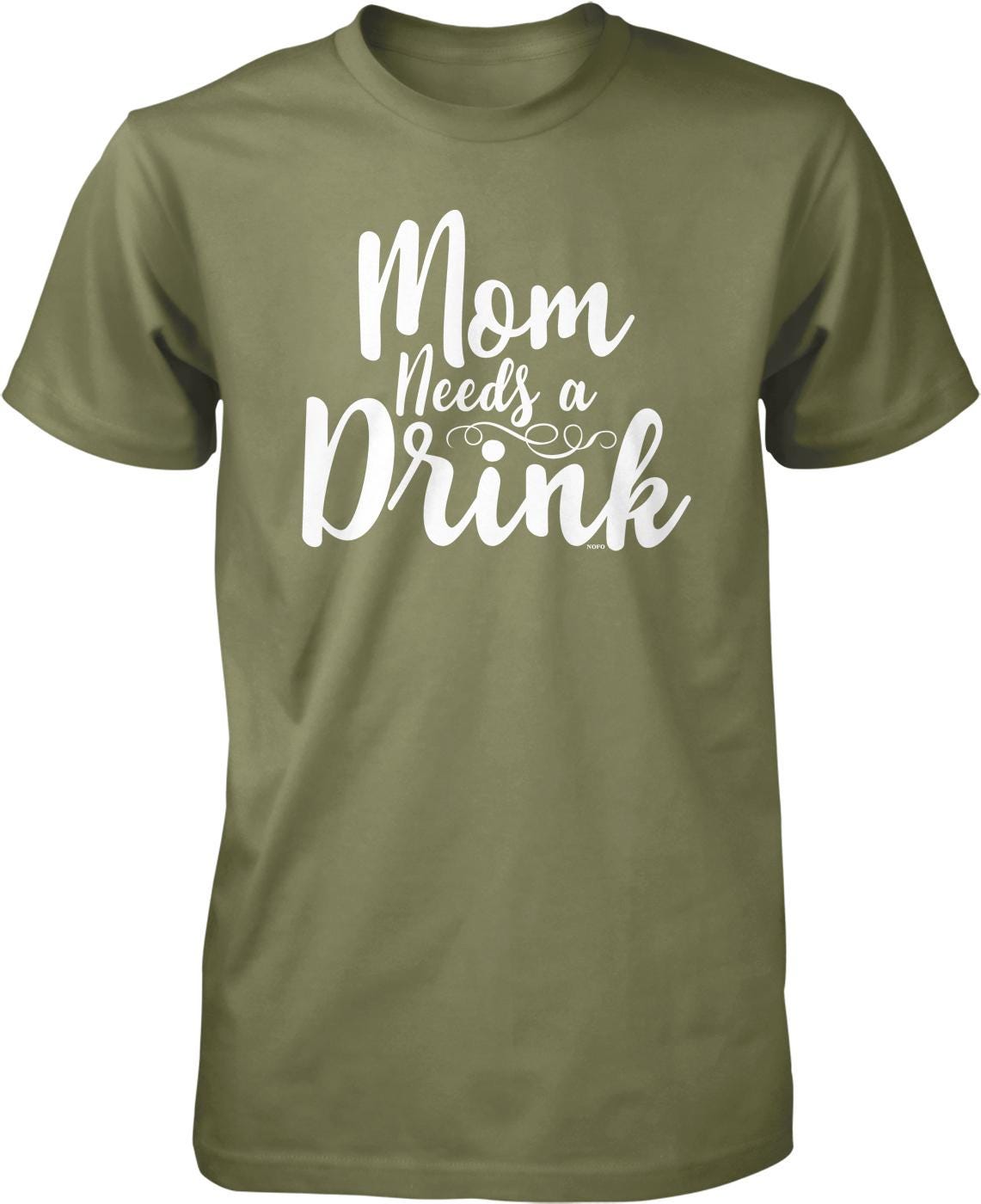 A green t-shirt with white text that says "Mom Needs a Drink".