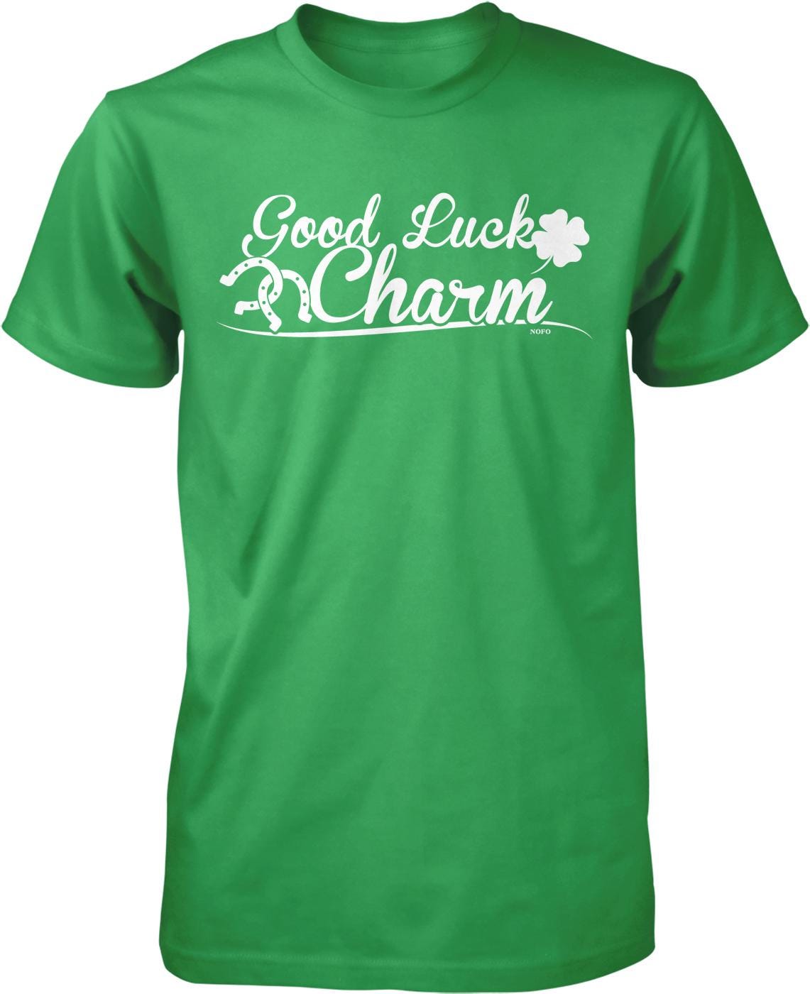 A green t-shirt with the text "Good Luck Charm" printed on it.