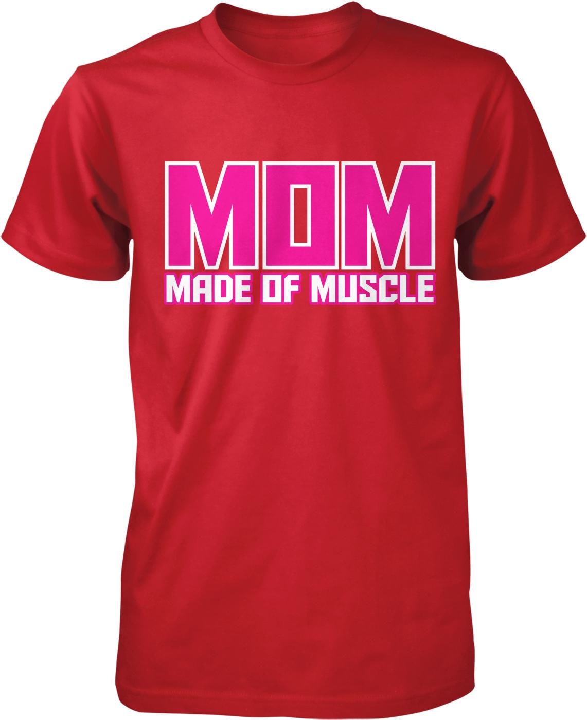 A red t-shirt with the text "MOM MADE OF MUSCLE" printed on it in pink and white letters.