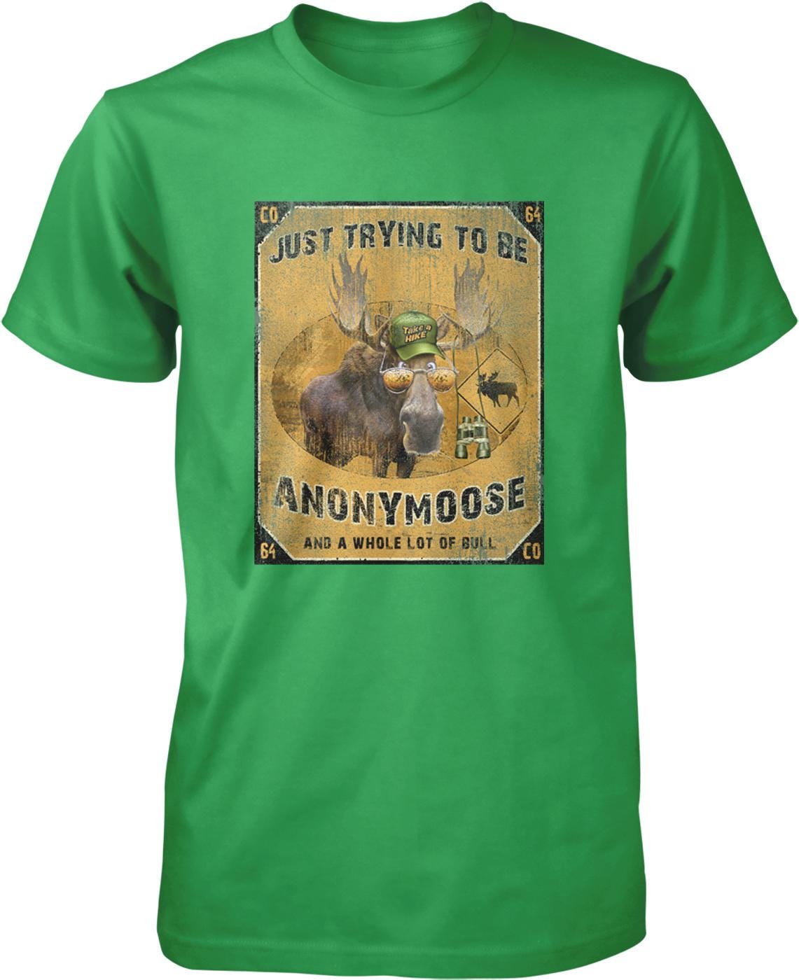 A green t-shirt with a graphic design featuring a moose wearing a hat and the text "Just trying to be Anonymous Moose and a whole lot of Bull".